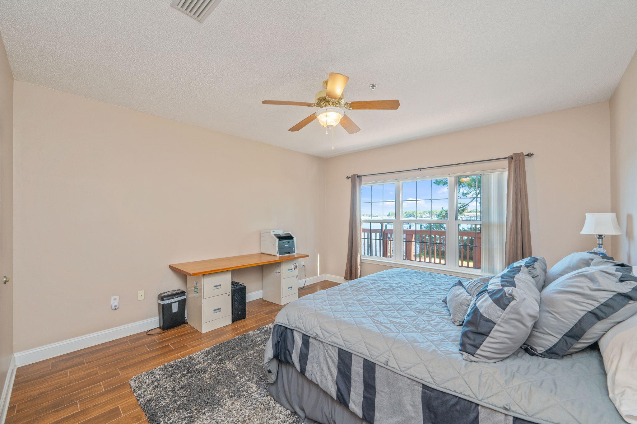 5 Laguna Street, Unit 104 Fort Walton Beach, FL 32548 - Photo 19 of 40 a bedroom with a bed and a table