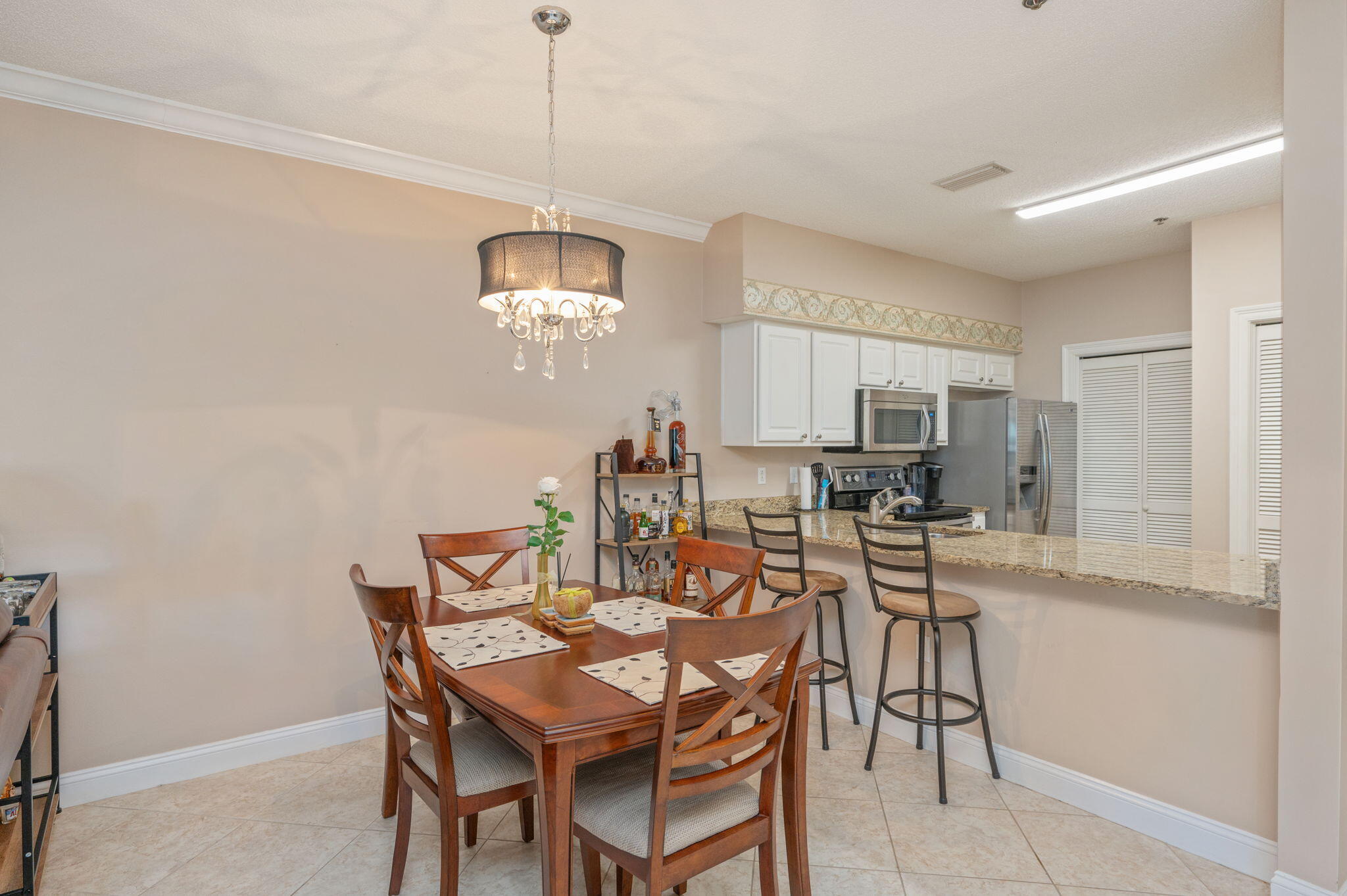 5 Laguna Street, Unit 104 Fort Walton Beach, FL 32548 - Photo 8 of 40 a view of a dining room with furniture