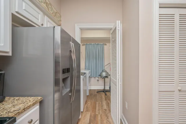 a bathroom with a granite countertop sink and shower