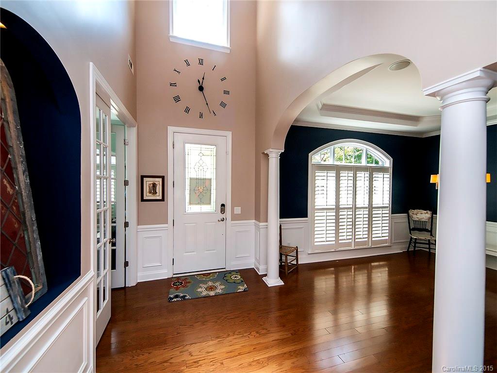 735 Quicksilver Trail Fort Mill, SC 29708 - Photo 2 of 20 a view of an entryway with wooden floor