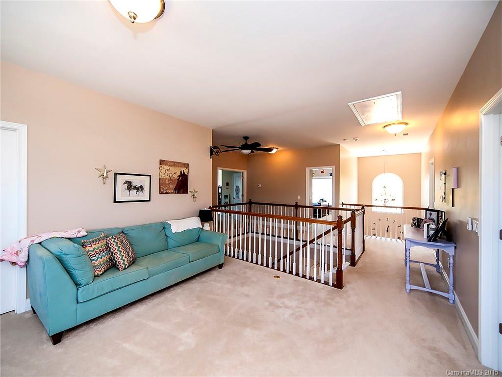 735 Quicksilver Trail Fort Mill, SC 29708 - Photo 11 of 20 a view of a livingroom with furniture and a couch