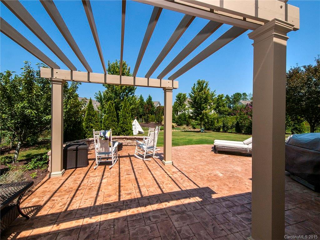 735 Quicksilver Trail Fort Mill, SC 29708 - Photo 17 of 20 a view of a patio with a table chairs and a backyard
