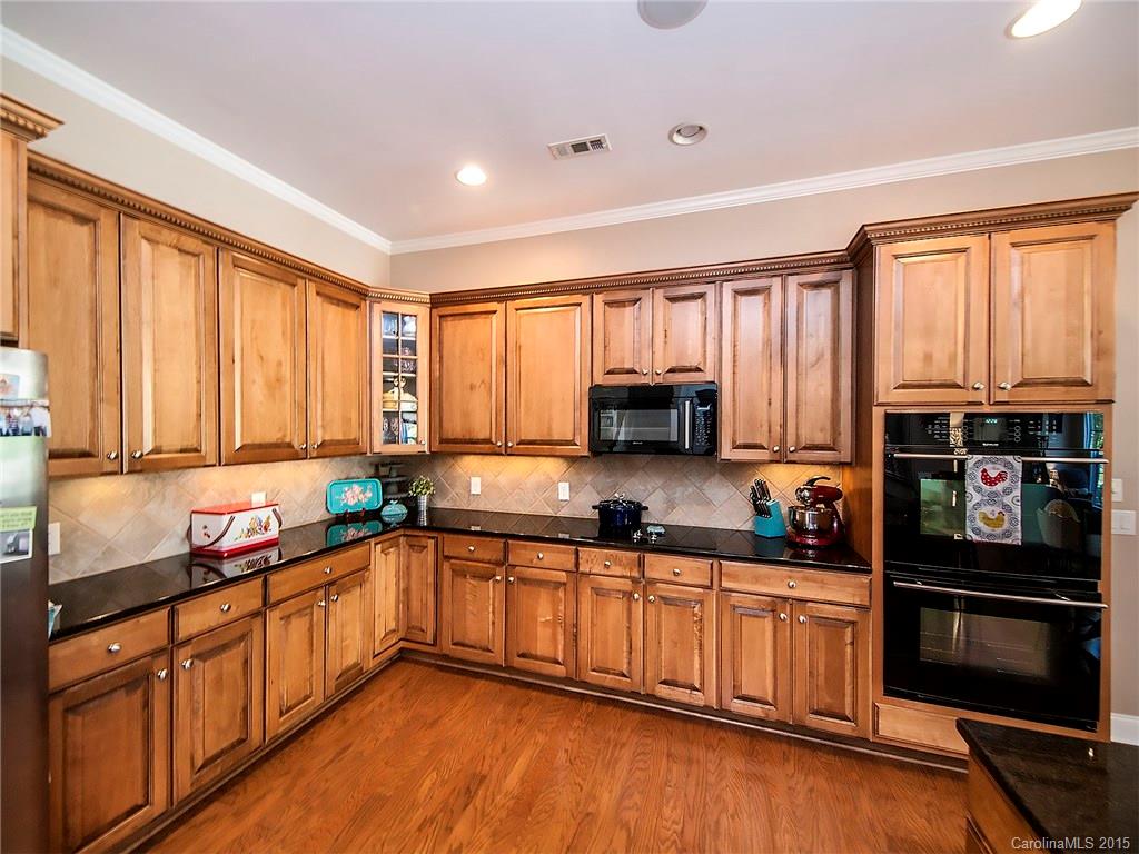 735 Quicksilver Trail Fort Mill, SC 29708 - Photo 5 of 20 a kitchen with stainless steel appliances a sink window and cabinets