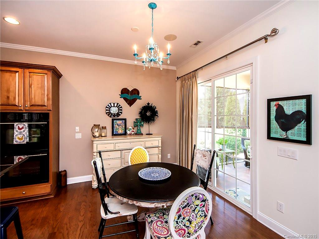 735 Quicksilver Trail Fort Mill, SC 29708 - Photo 7 of 20 a dining room with furniture and wooden floor