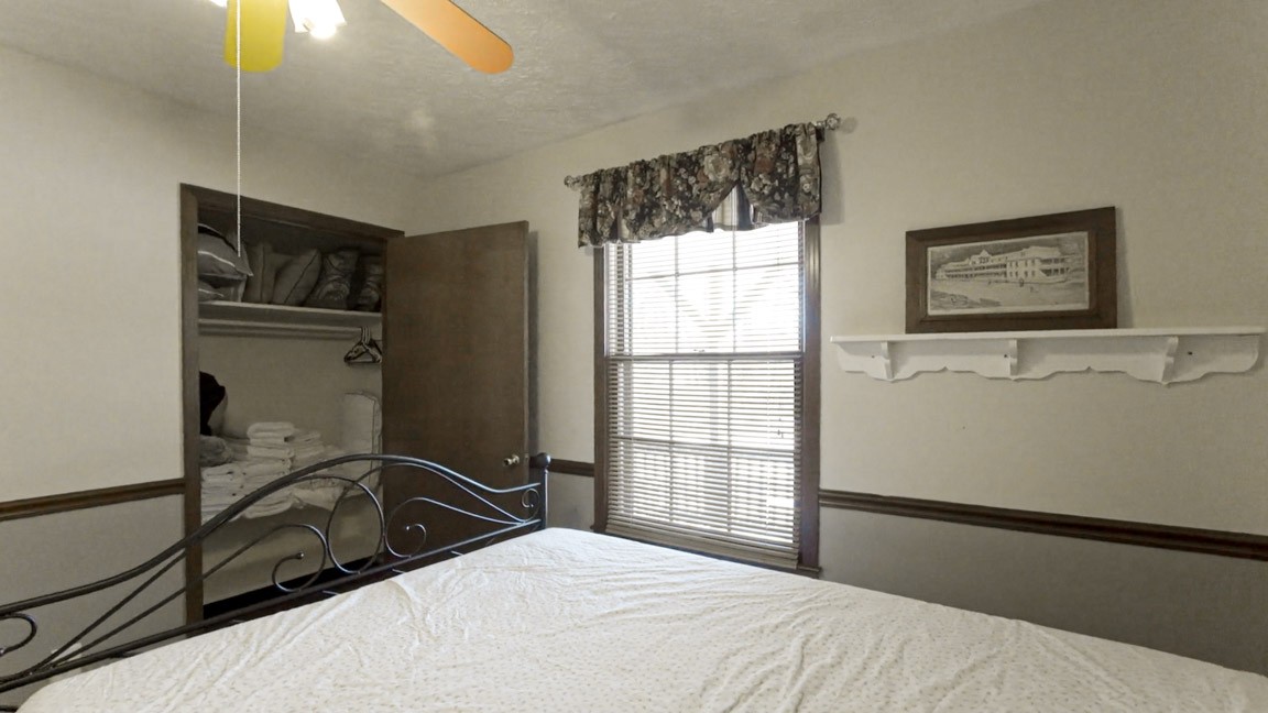 9300 Missionary Ridge Road Bon Aqua, TN 37025 - Photo 14 of 29 a bedroom with a bed and a window