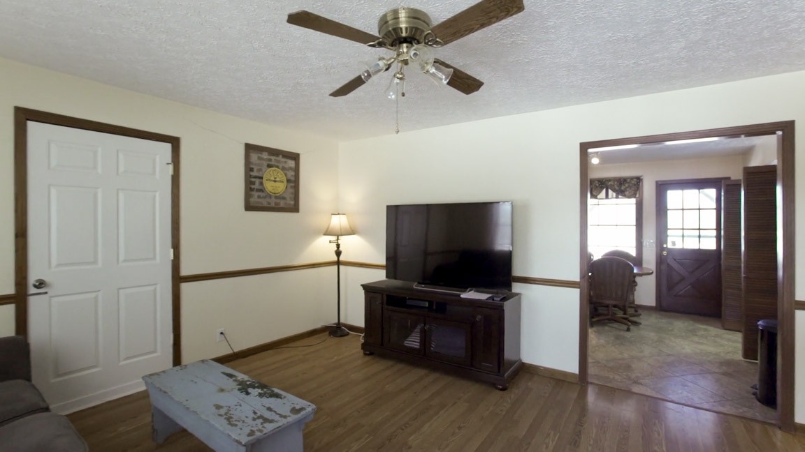 9300 Missionary Ridge Road Bon Aqua, TN 37025 - Photo 4 of 29 a living room with furniture and a flat screen tv