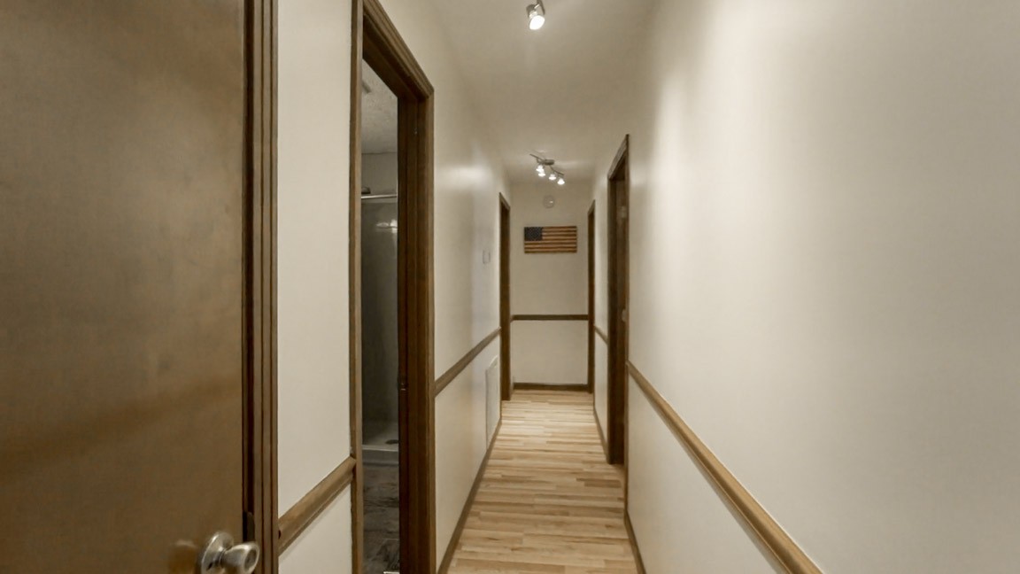 9300 Missionary Ridge Road Bon Aqua, TN 37025 - Photo 8 of 29 a view of a hallway with a wooden floor