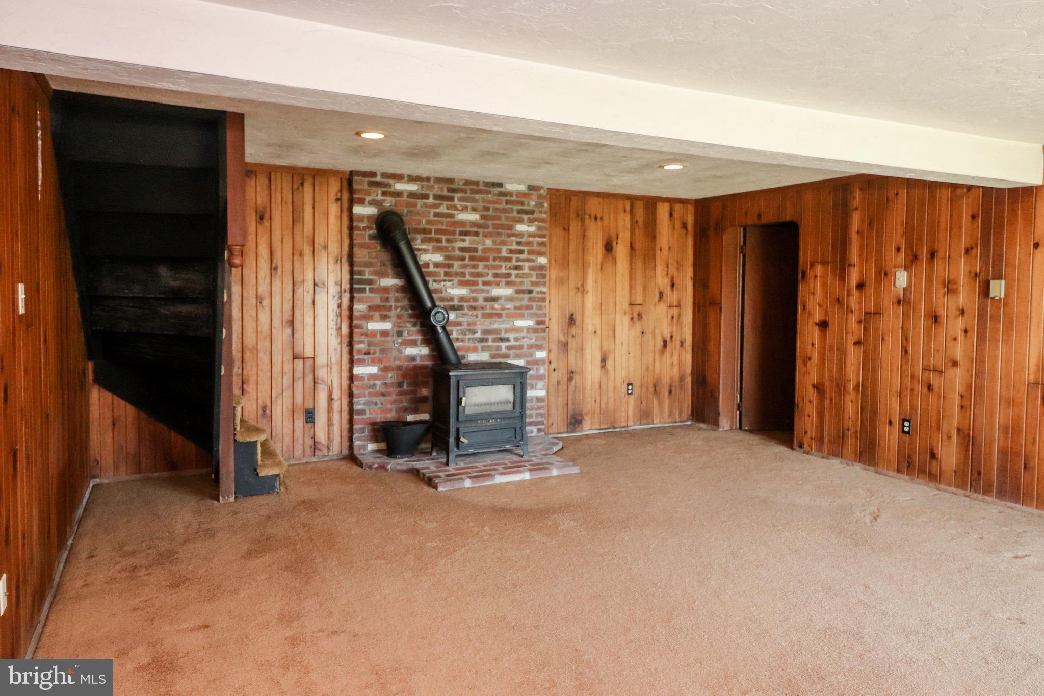 480 Blue Lake Road Denver, PA 17517 - Photo 32 of 45 Lower Level Family Room with Wood Stove