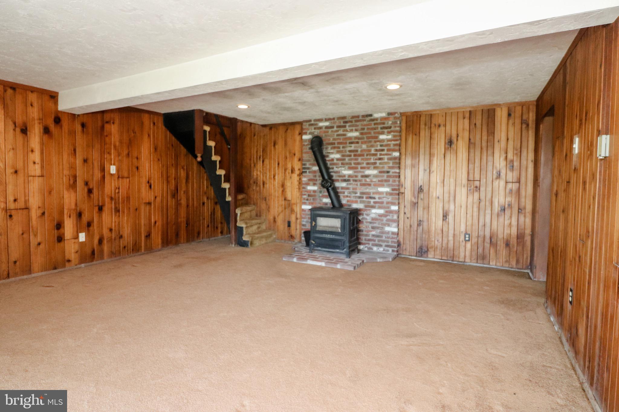 480 Blue Lake Road Denver, PA 17517 - Photo 33 of 45 Lower Level Family Room with Wood Stove