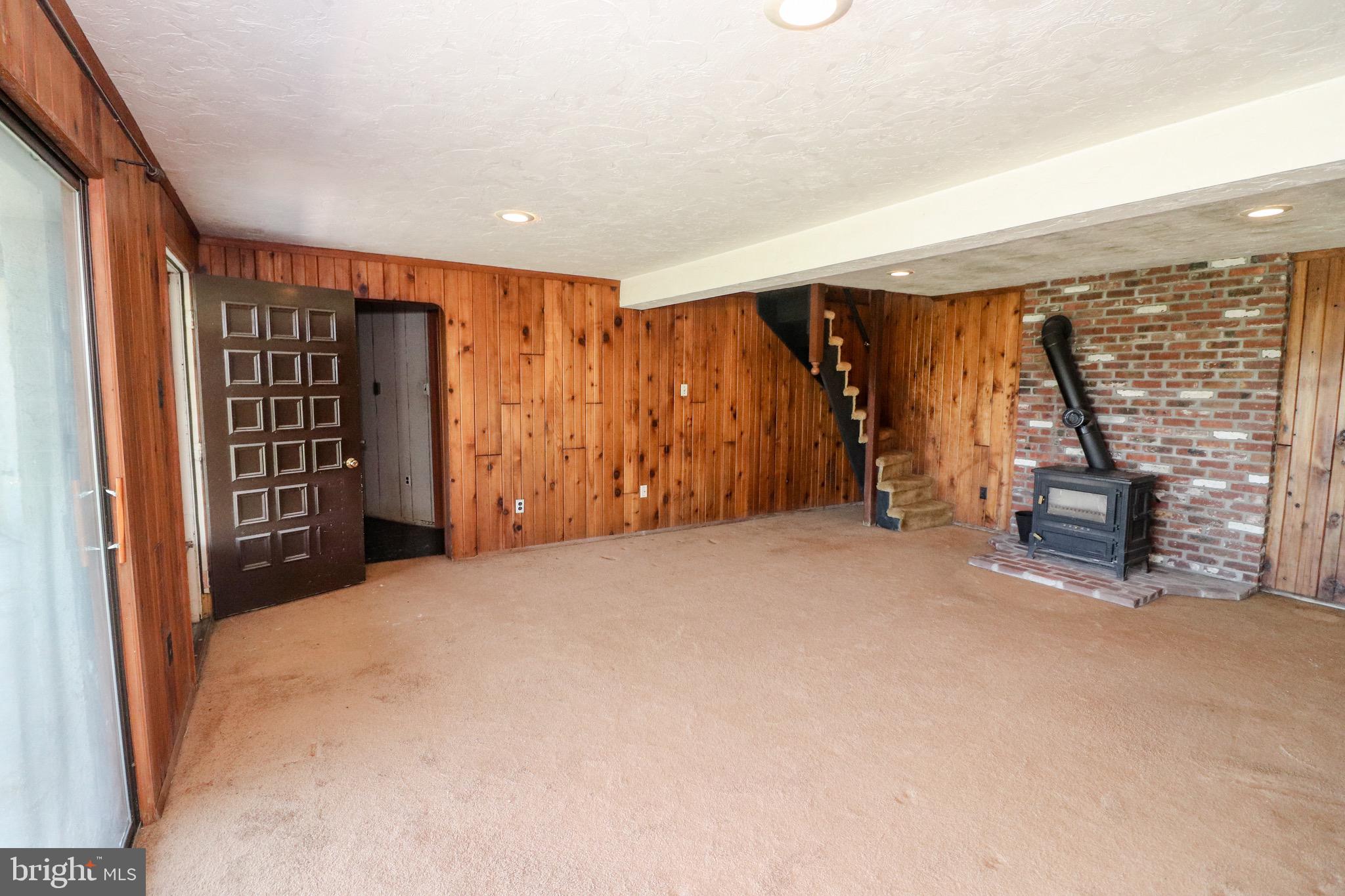 480 Blue Lake Road Denver, PA 17517 - Photo 34 of 45 Lower Level Family Room with Wood Stove
