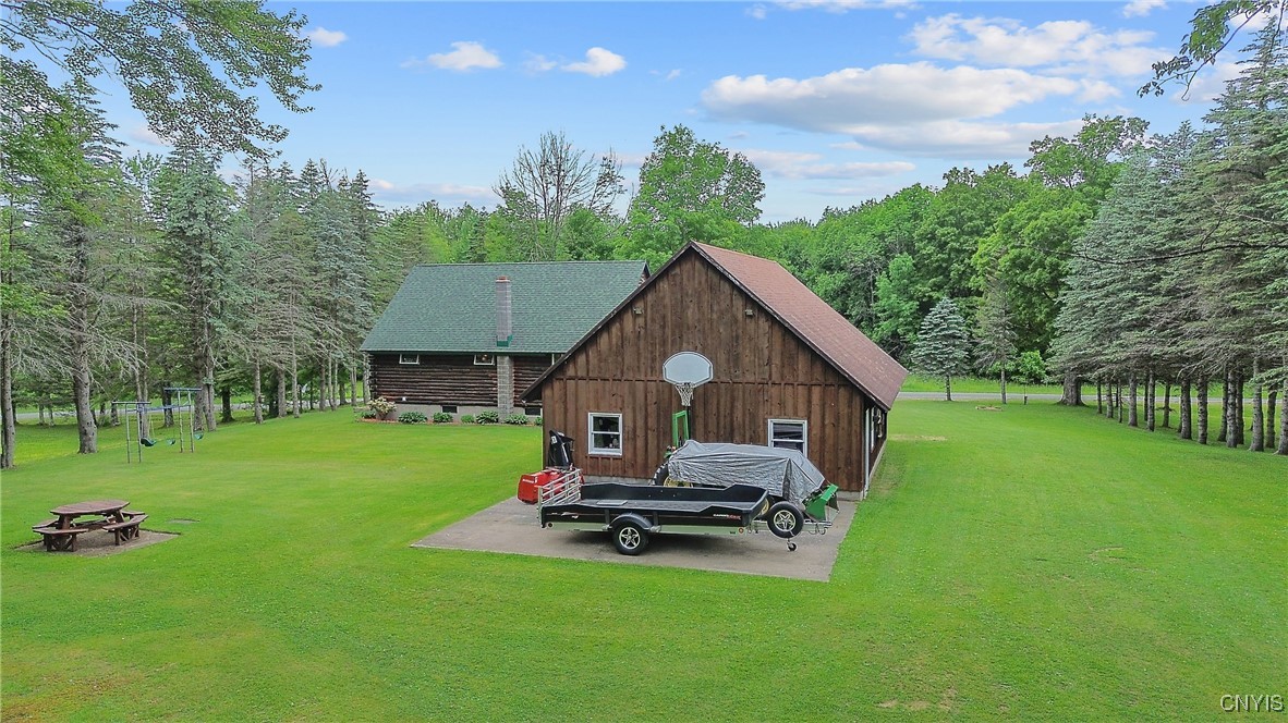 854 County Rte 19 Williamstown, NY 13493 - Photo 40 of 50 Drone shot of yard, back of garage with concrete p
