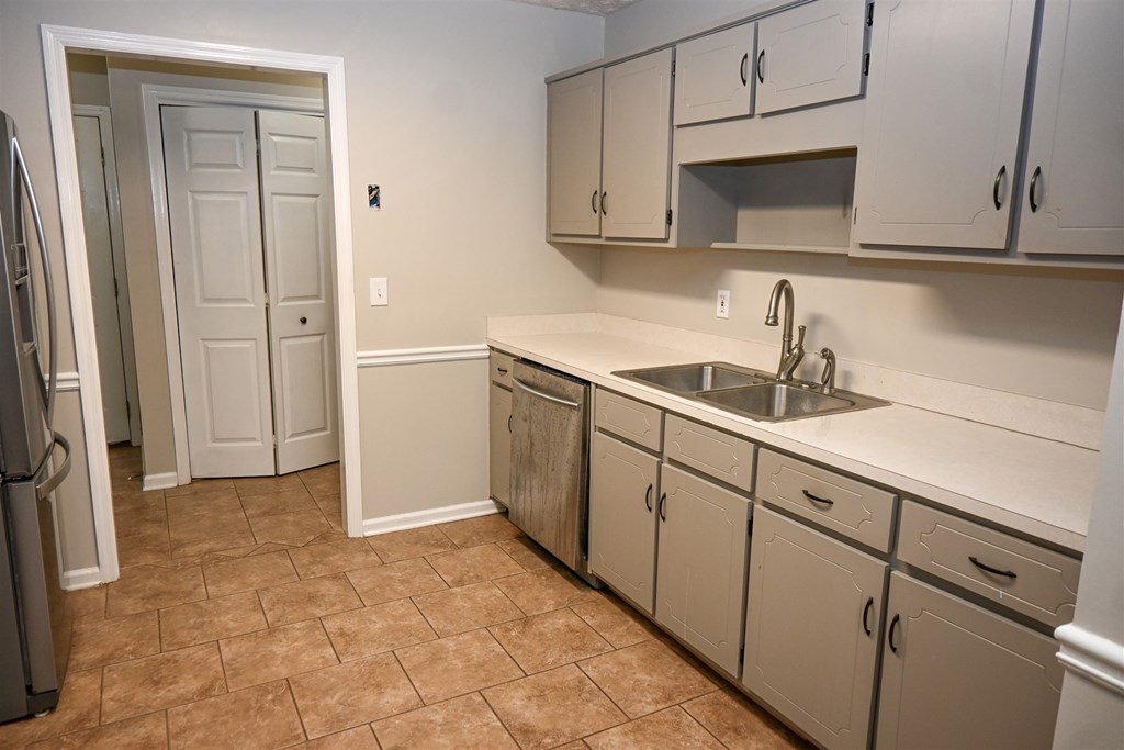 332 West Pine Drive Fortson, GA 31808 - Photo 12 of 26 a kitchen with sink cabinets and microwave