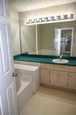 a bathroom with a sink and a bathtub