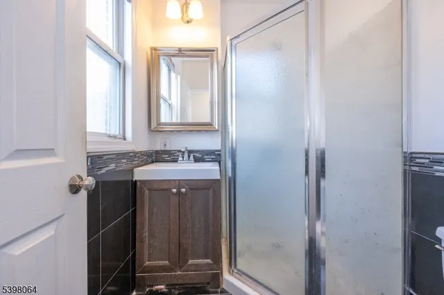 a view of a bathroom with a sink and mirror