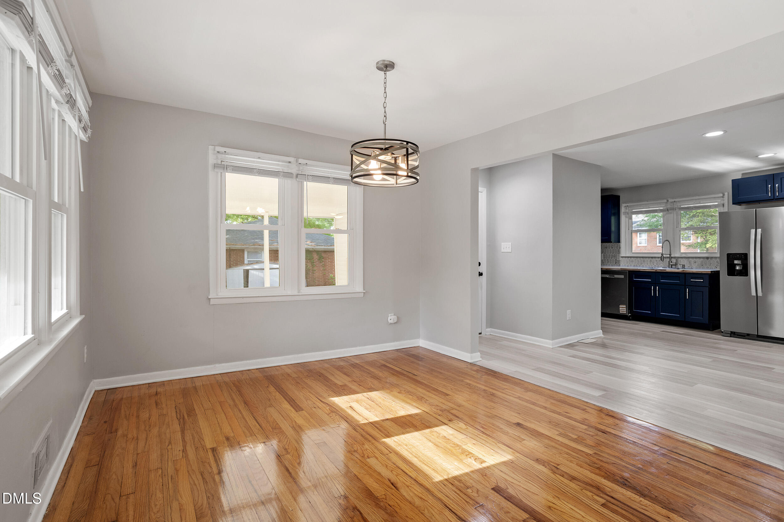 2414 Chapin Street Durham, NC 27707 - Photo 7 of 30 a view of an empty room with window and wooden floor