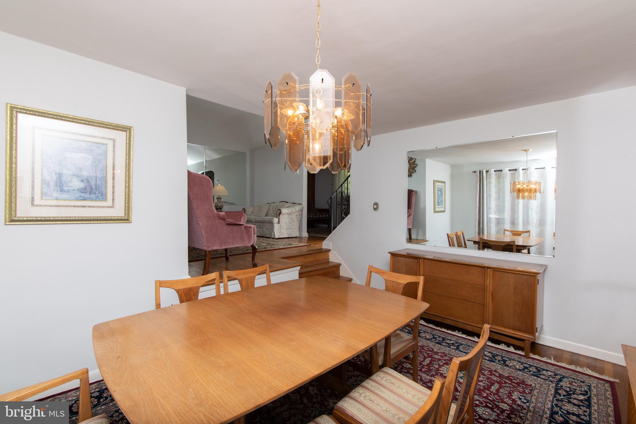 12 Brookmead Drive Cherry Hill, NJ 08034 - Photo 12 of 47 a room with table chairs and a chandelier