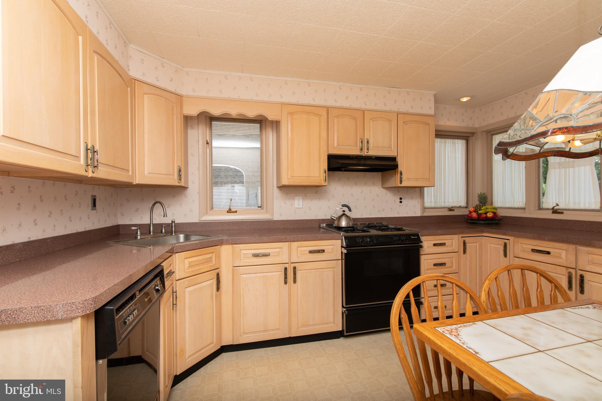 12 Brookmead Drive Cherry Hill, NJ 08034 - Photo 13 of 47 a kitchen with a sink stove and cabinets