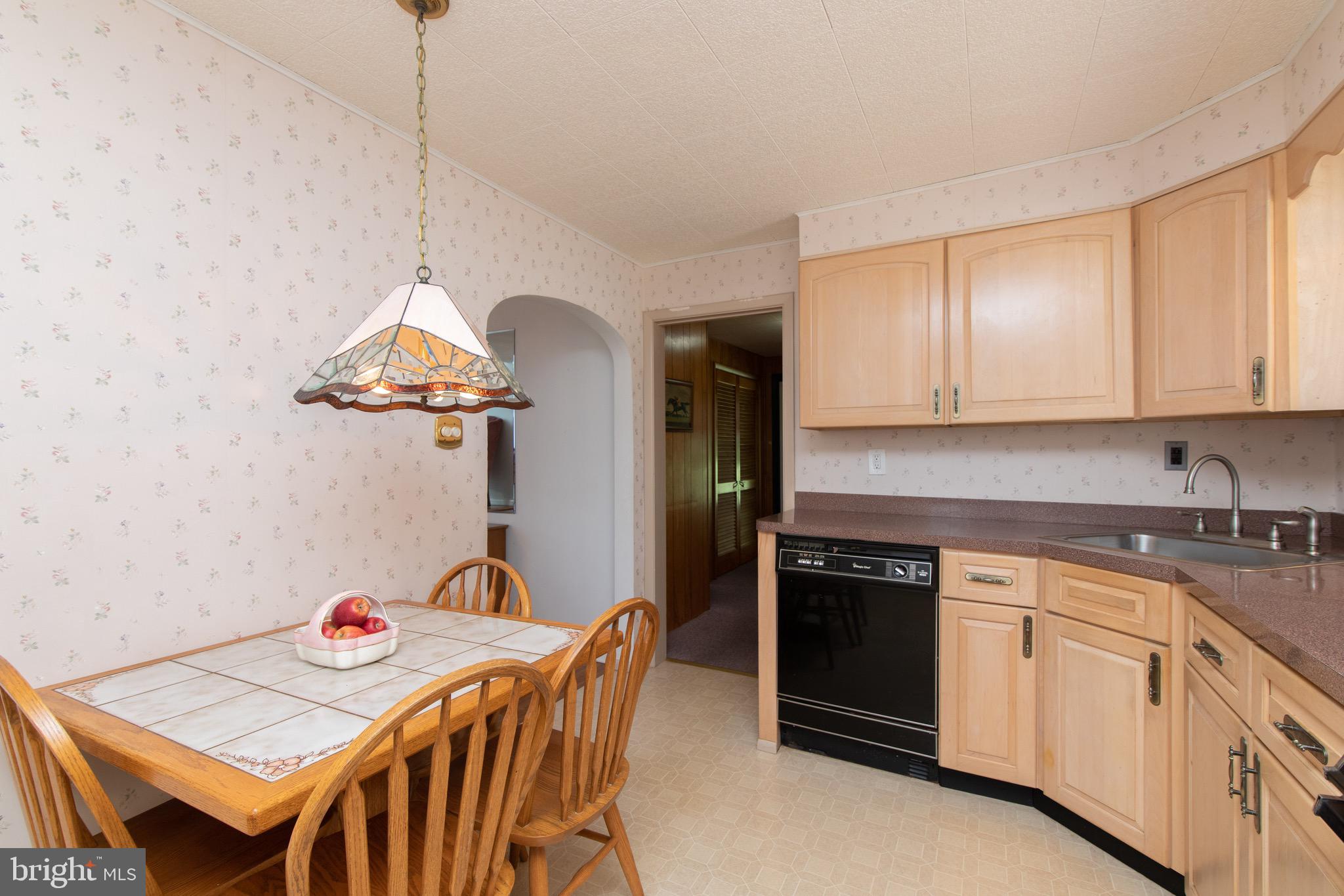 12 Brookmead Drive Cherry Hill, NJ 08034 - Photo 14 of 47 a kitchen with stainless steel appliances a stove a sink a dining table and chairs