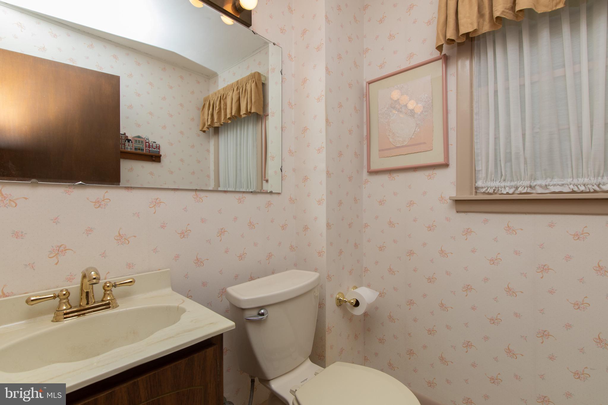 12 Brookmead Drive Cherry Hill, NJ 08034 - Photo 21 of 47 a bathroom with a sink a toilet and mirror