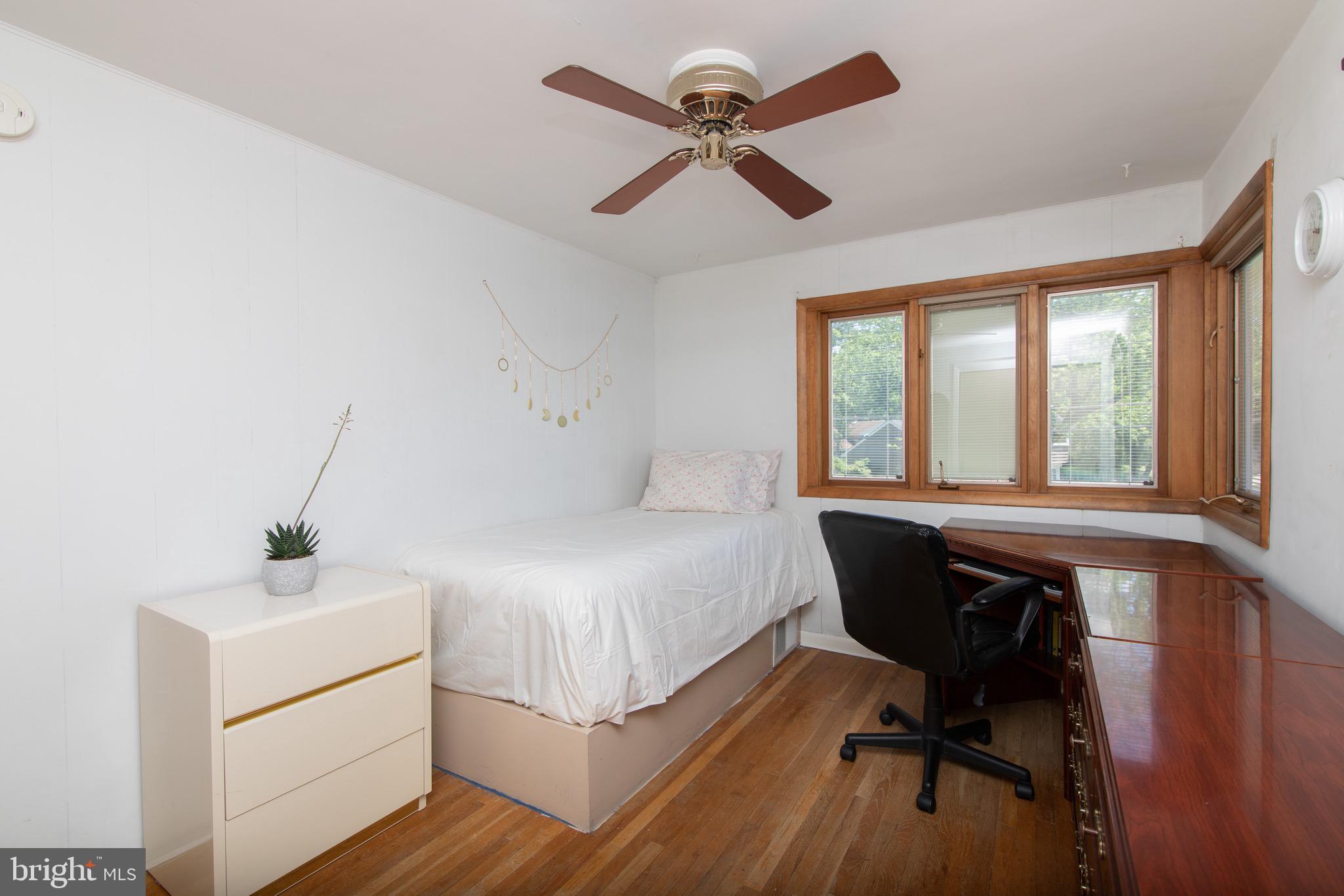 12 Brookmead Drive Cherry Hill, NJ 08034 - Photo 29 of 47 a bedroom with a bed and a desk