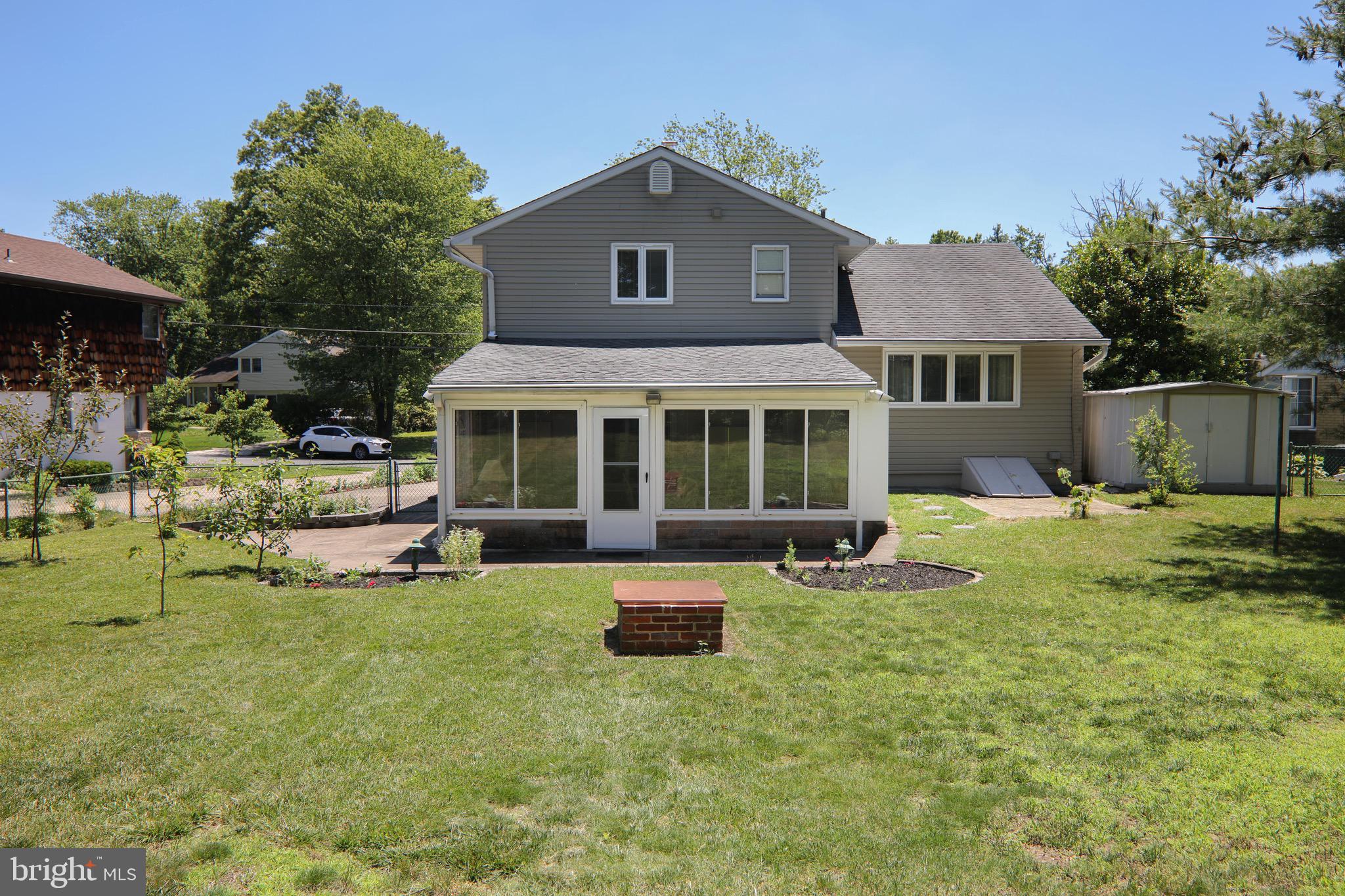 12 Brookmead Drive Cherry Hill, NJ 08034 - Photo 43 of 47 a front view of a house with a yard and trees