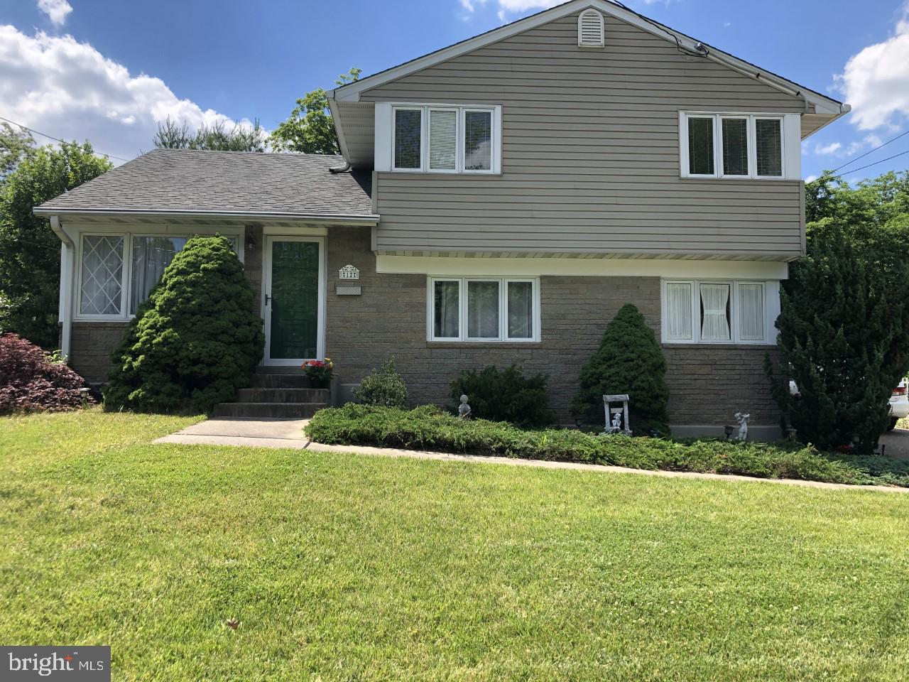 12 Brookmead Drive Cherry Hill, NJ 08034 - Photo 47 of 47 a front view of a house with a yard and garage