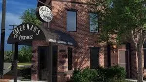 a view of a brick building with a clock on the wall