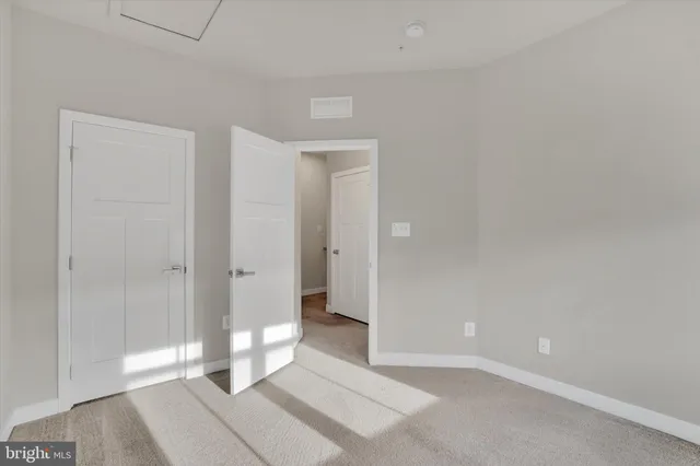 a view of a room with large glass door