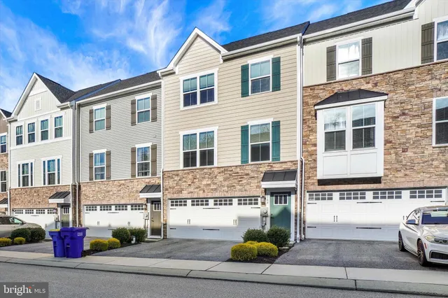 a view of a white building among the street