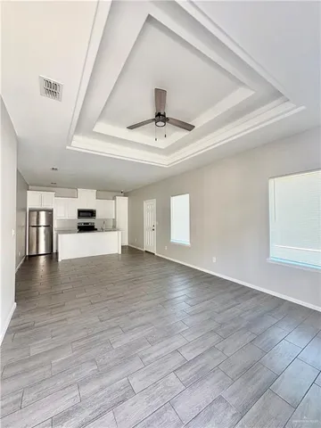 a view of a kitchen with a sink and dishwasher cabinets