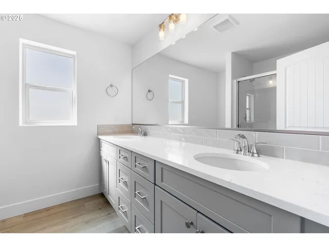 a bathroom with a sink a vanity and a mirror