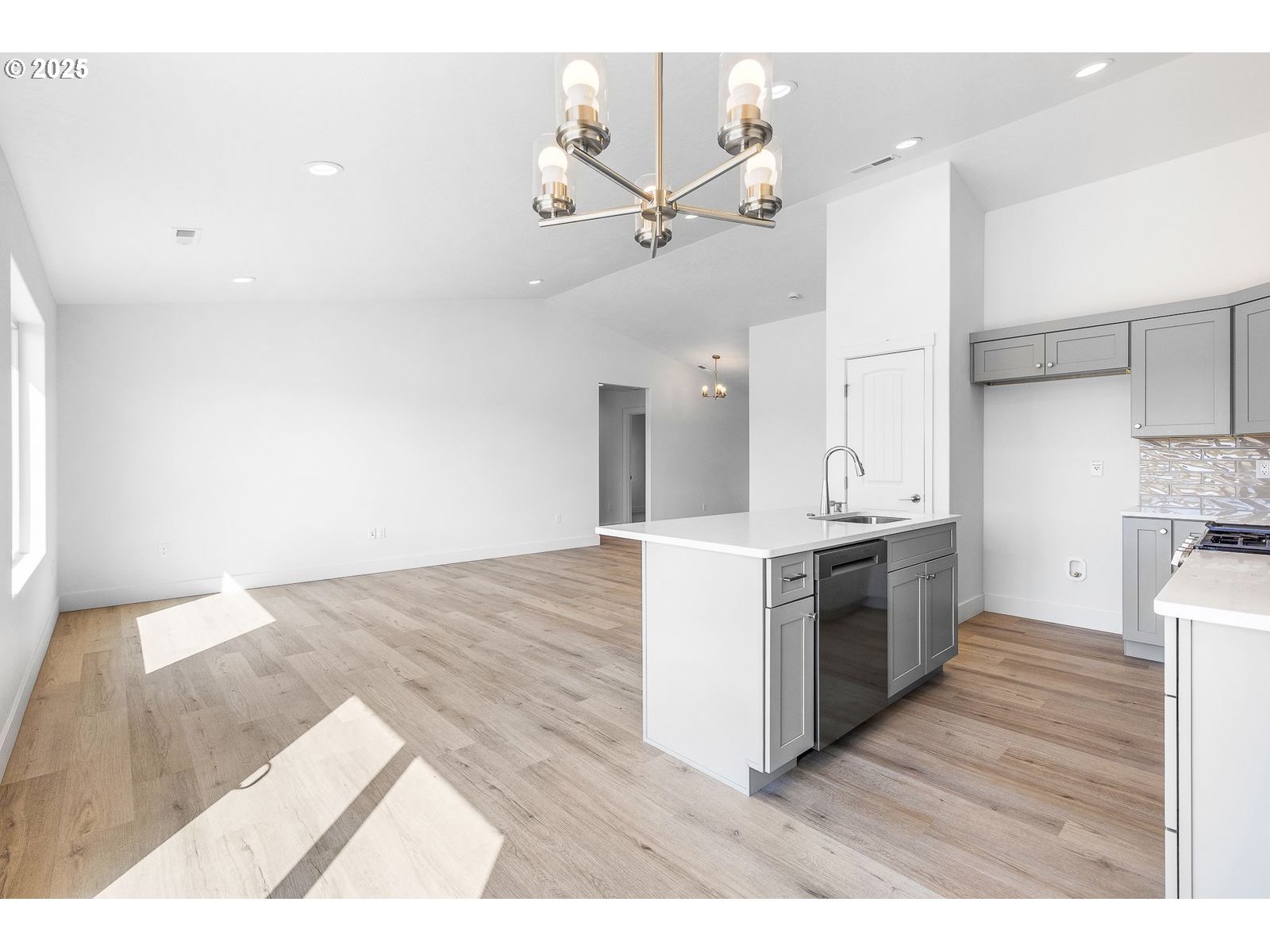 117 Tiber Street Boardman, OR 97818 - Photo 20 of 26 a kitchen with granite countertop a stove a sink and a refrigerator