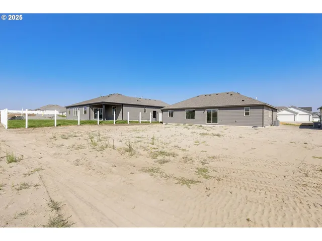 a view of house with a yard