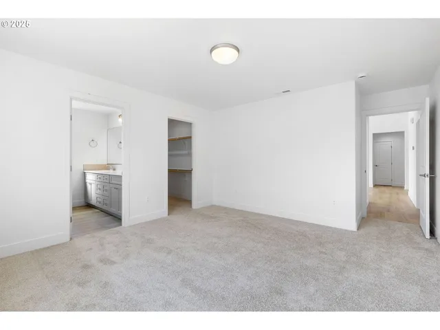 a view of an empty room with a bathroom