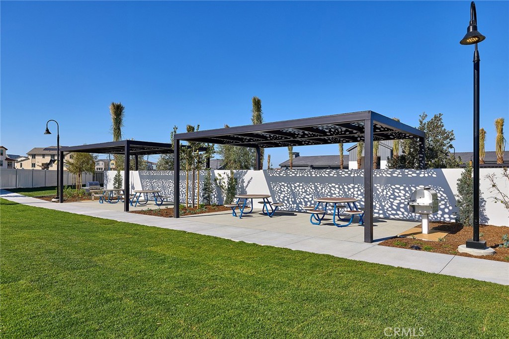 5911 Rockport Road Eastvale, CA 92880 - Photo 32 of 39 a view of a house with sitting area and porch