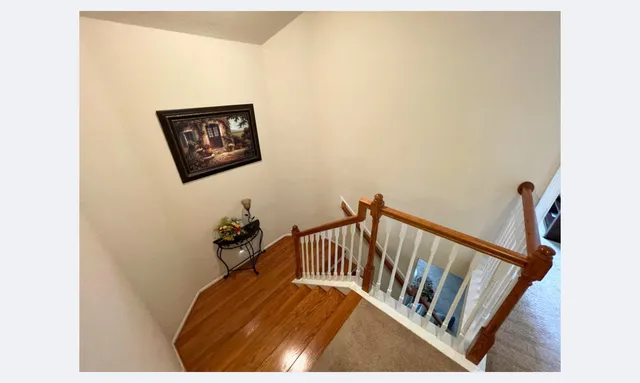 a view of hallway with furniture