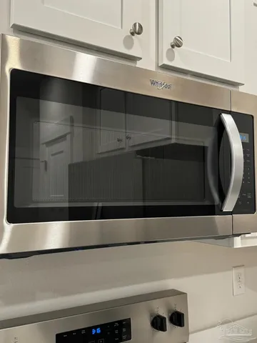 a bathroom with a granite countertop sink
