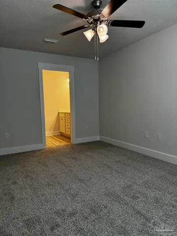 a bathroom with a shower and a toilet