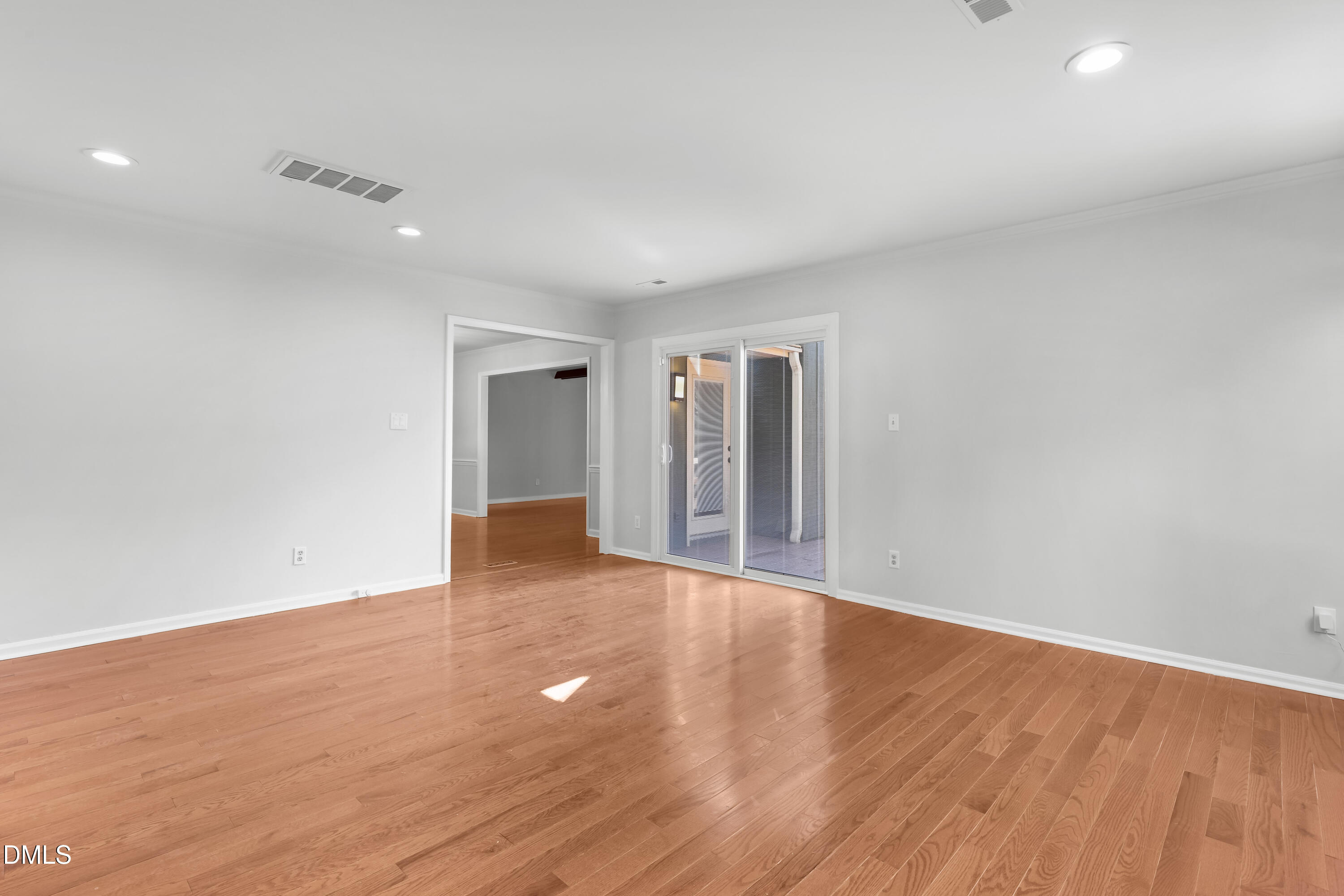 3504 Fairhill Drive Raleigh, NC 27612 - Photo 18 of 45 a view of an empty room with wooden floor