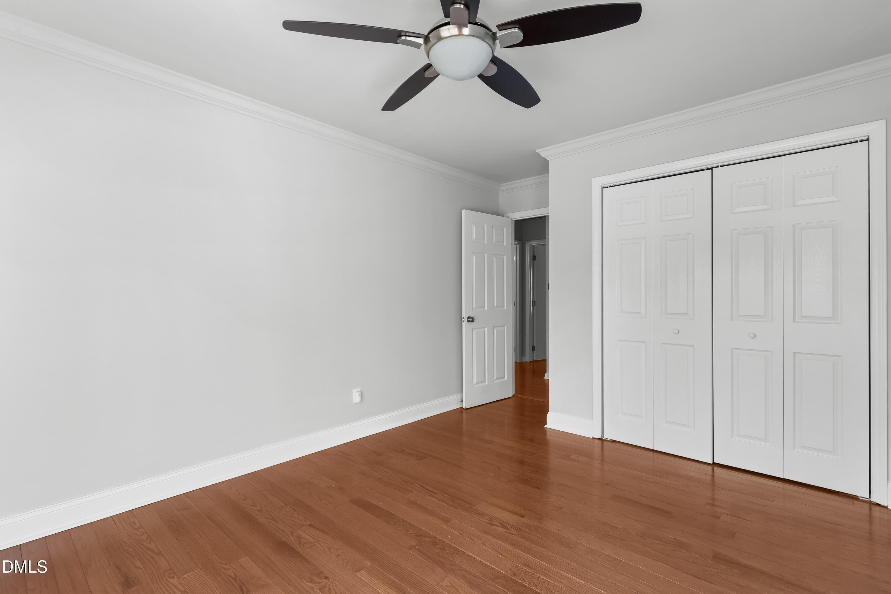 3504 Fairhill Drive Raleigh, NC 27612 - Photo 22 of 45 a view of an empty room with wooden floor