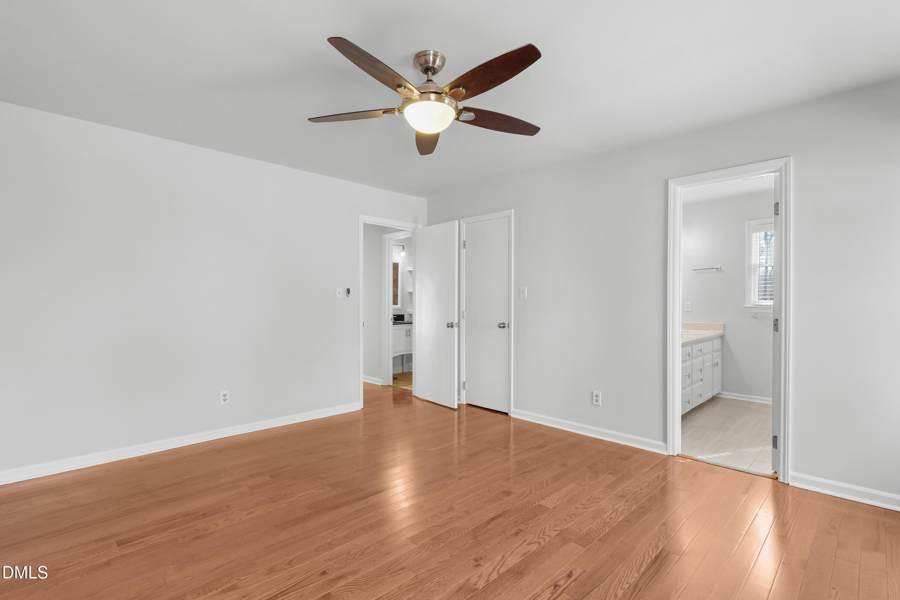 3504 Fairhill Drive Raleigh, NC 27612 - Photo 27 of 45 an empty room with wooden floor and ceiling fan