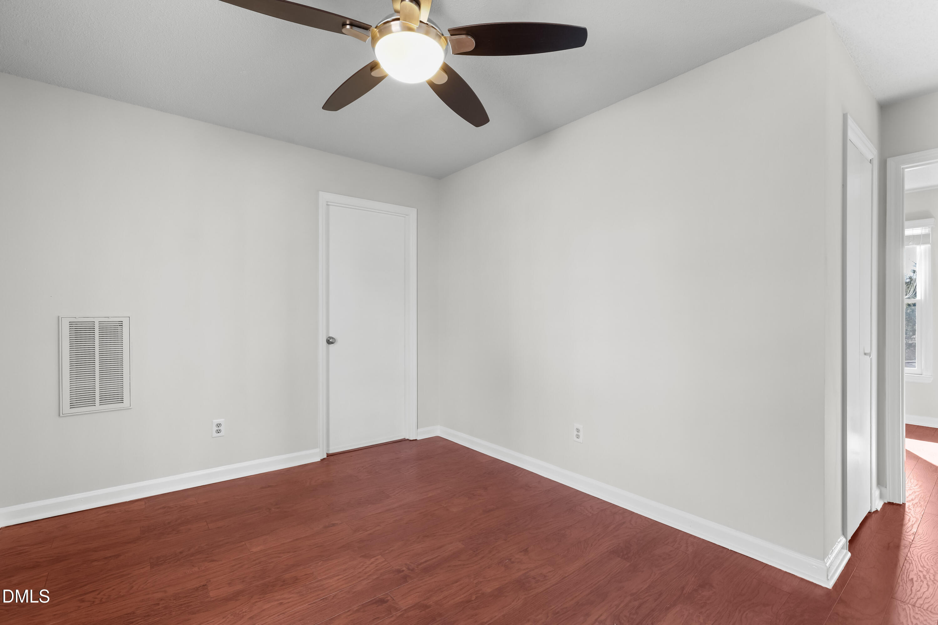 3504 Fairhill Drive Raleigh, NC 27612 - Photo 30 of 45 an empty room with a window and a fan