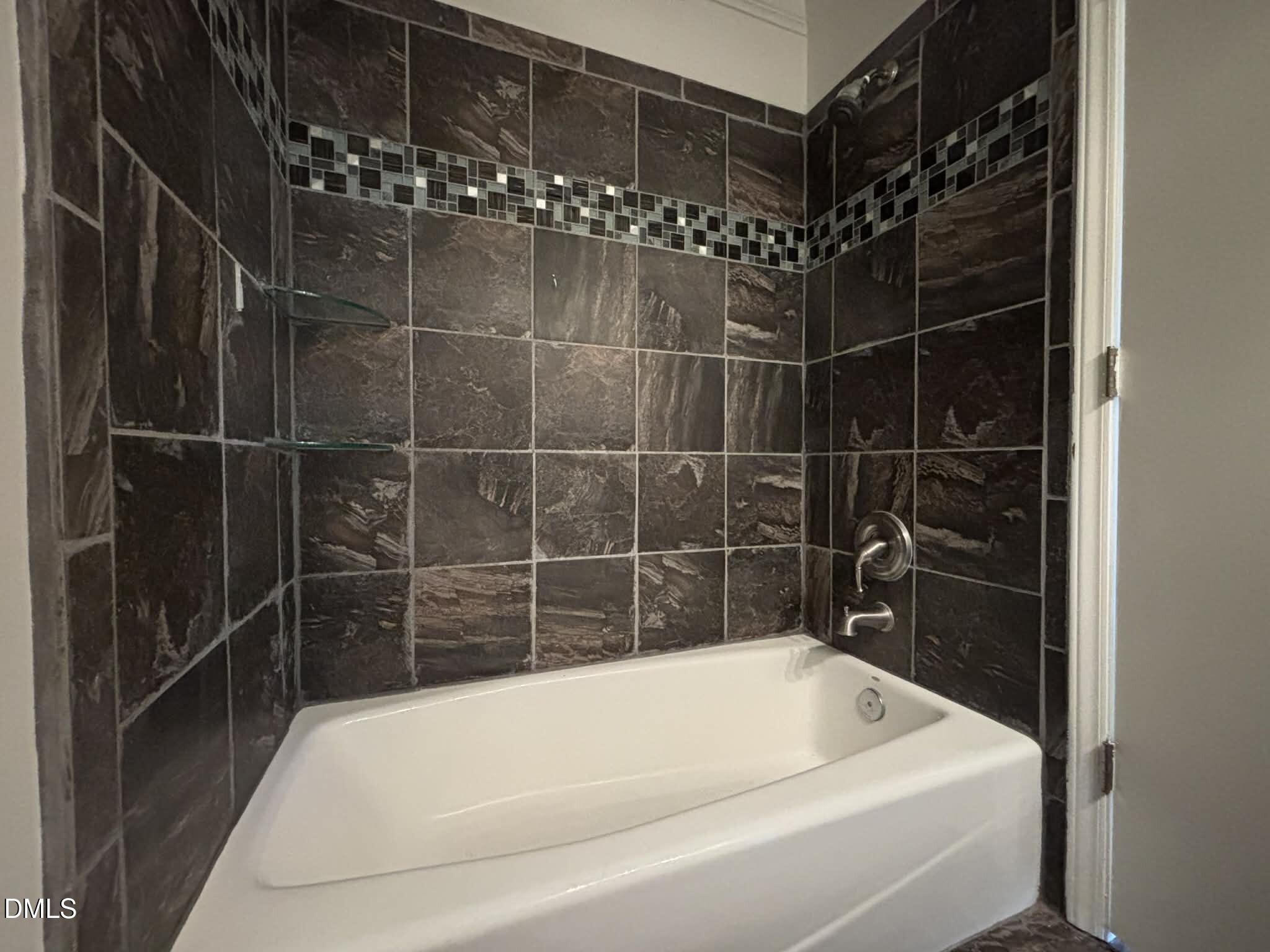 3504 Fairhill Drive Raleigh, NC 27612 - Photo 33 of 45 a bathroom with a bathtub and shower