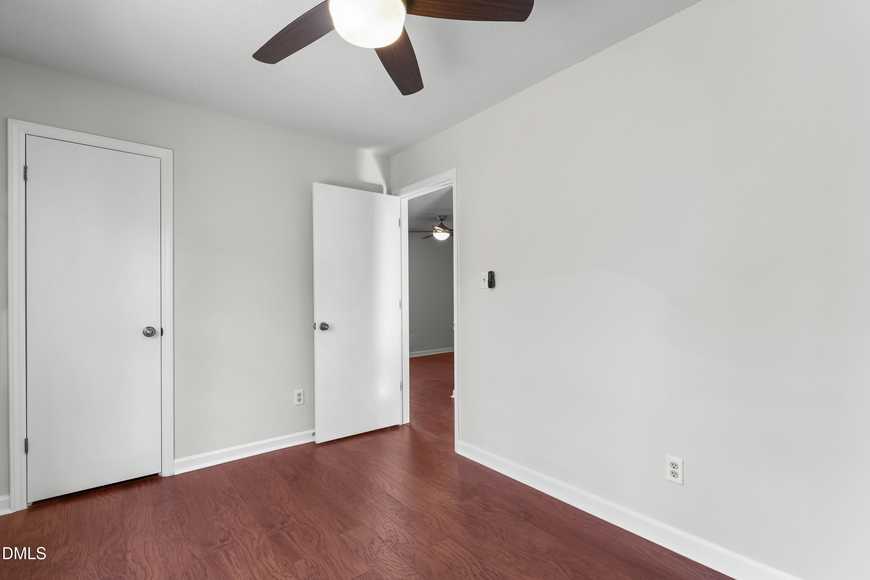 3504 Fairhill Drive Raleigh, NC 27612 - Photo 35 of 45 a view of an empty room with wooden floor
