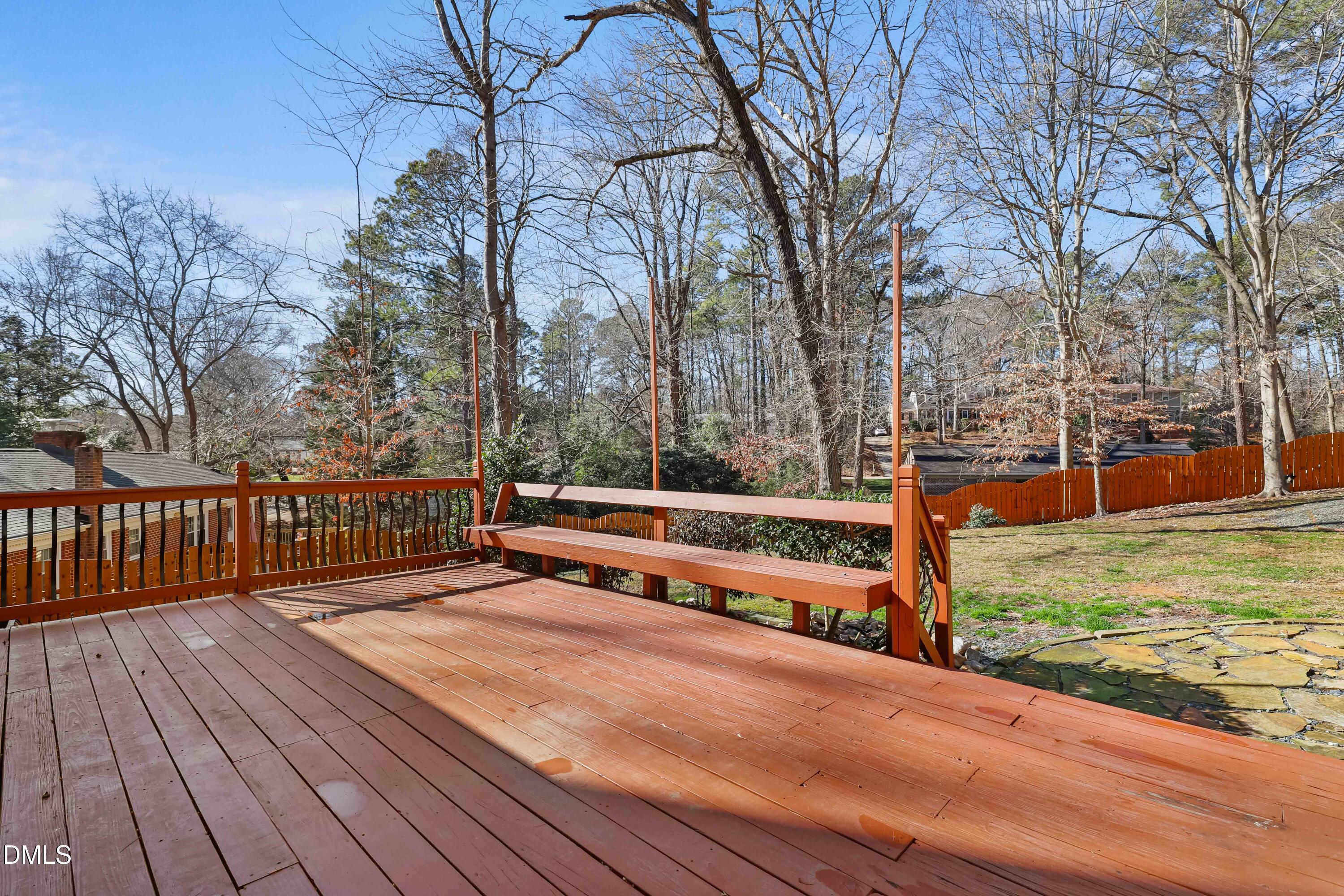 3504 Fairhill Drive Raleigh, NC 27612 - Photo 39 of 45 a view of wooden deck with trees in the background