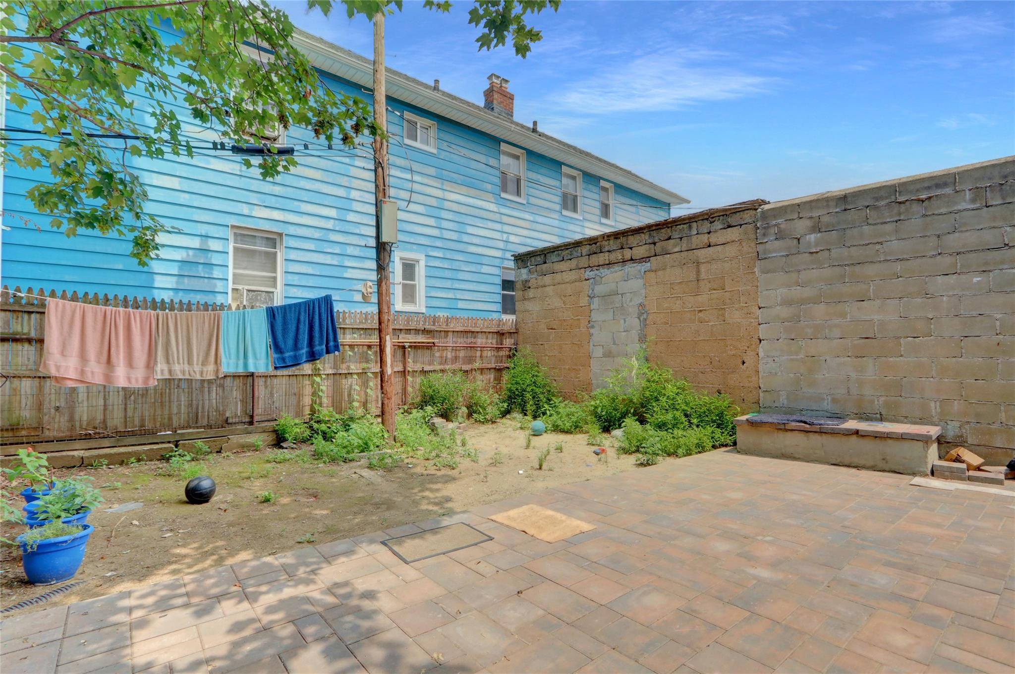 119-15 101st Avenue Queens, NY 11419 - Photo 20 of 20 Fenced backyard featuring a patio
