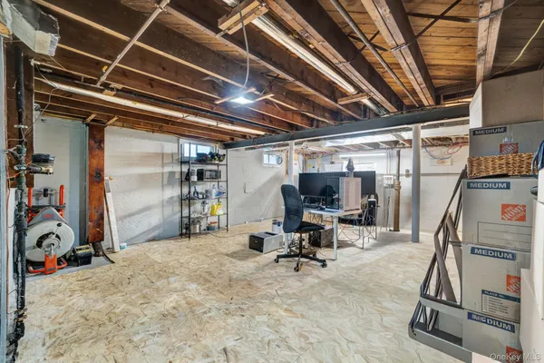 a view of an empty room with stairs