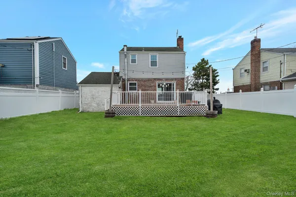 a view of a patio with table and chairs and wooden floor