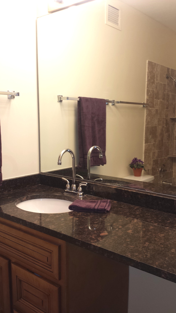 200 North Dearborn Street, Unit 1908 Chicago, IL 60601 - Photo 16 of 23 a bathroom with a sink and a mirror