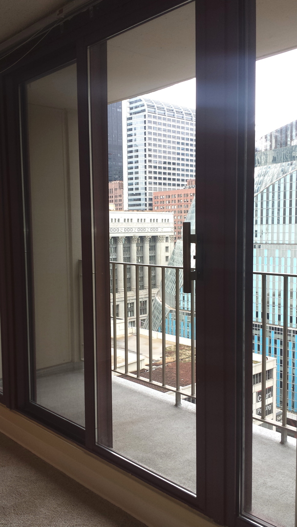 200 North Dearborn Street, Unit 1908 Chicago, IL 60601 - Photo 23 of 23 a view of a glass door with a door